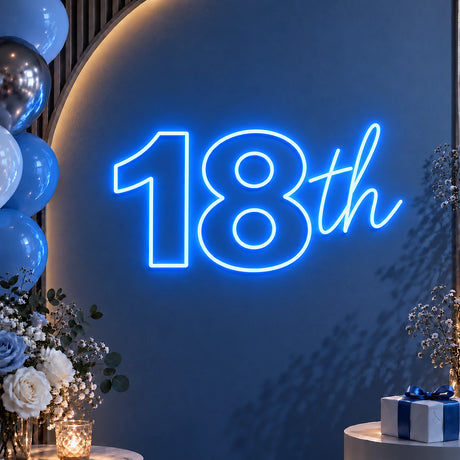 Blue 18th birthday neon sign on a balloon backdrop