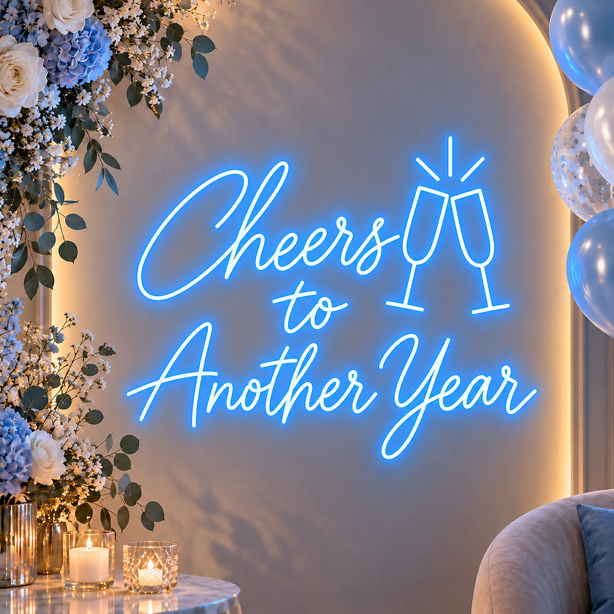 Blue Cheers to Another Year neon sign on a party backdrop