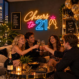 Cheers to 21 neon sign glowing blue at a party