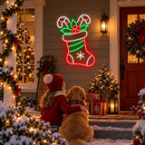 Christmas stocking and candy canes neon sign on a front porch