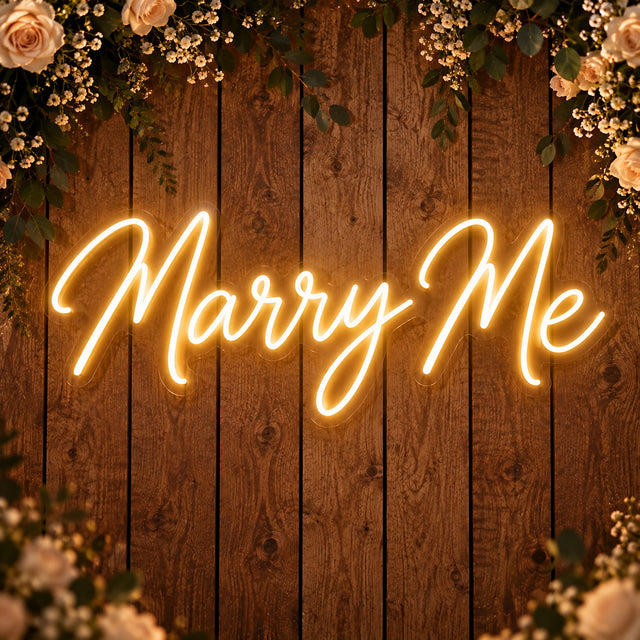 Marry Me neon sign on a wooden wall for a wedding proposal