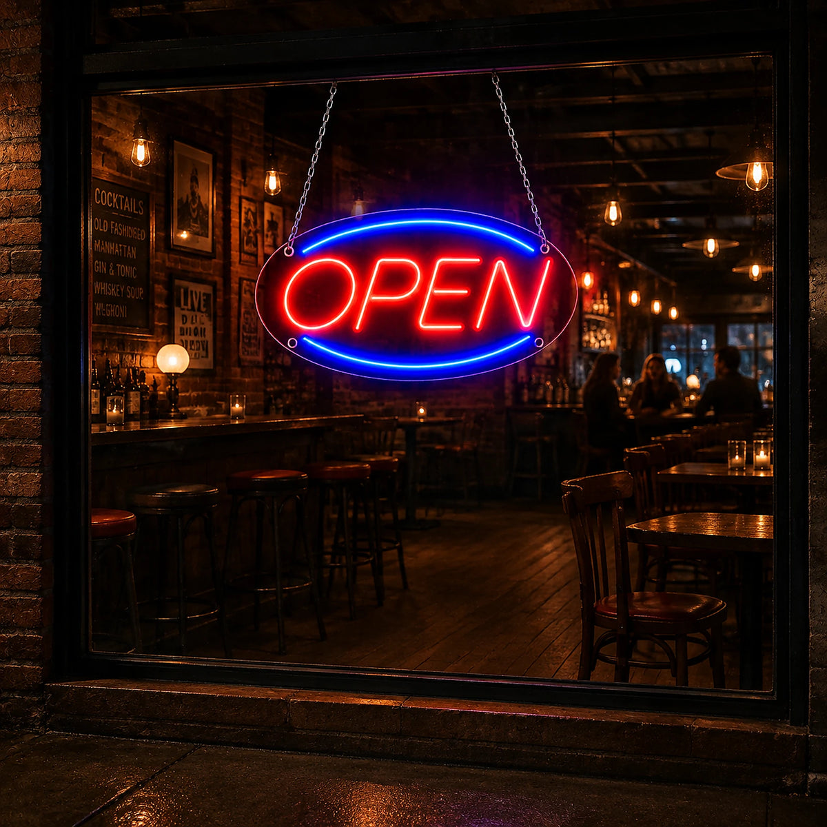 Classic red blue oval open LED neon sign glowing on a storefront