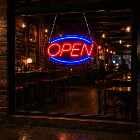 Classic red blue oval open LED neon sign glowing on a storefront