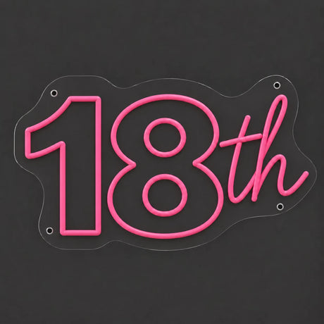 Pink 18th birthday neon sign lit on a dark gray background