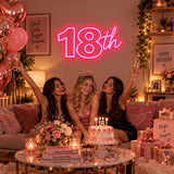 Pink 18th birthday neon sign at a birthday party