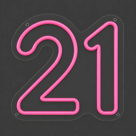 Pink number 21 neon sign lit on a dark gray background