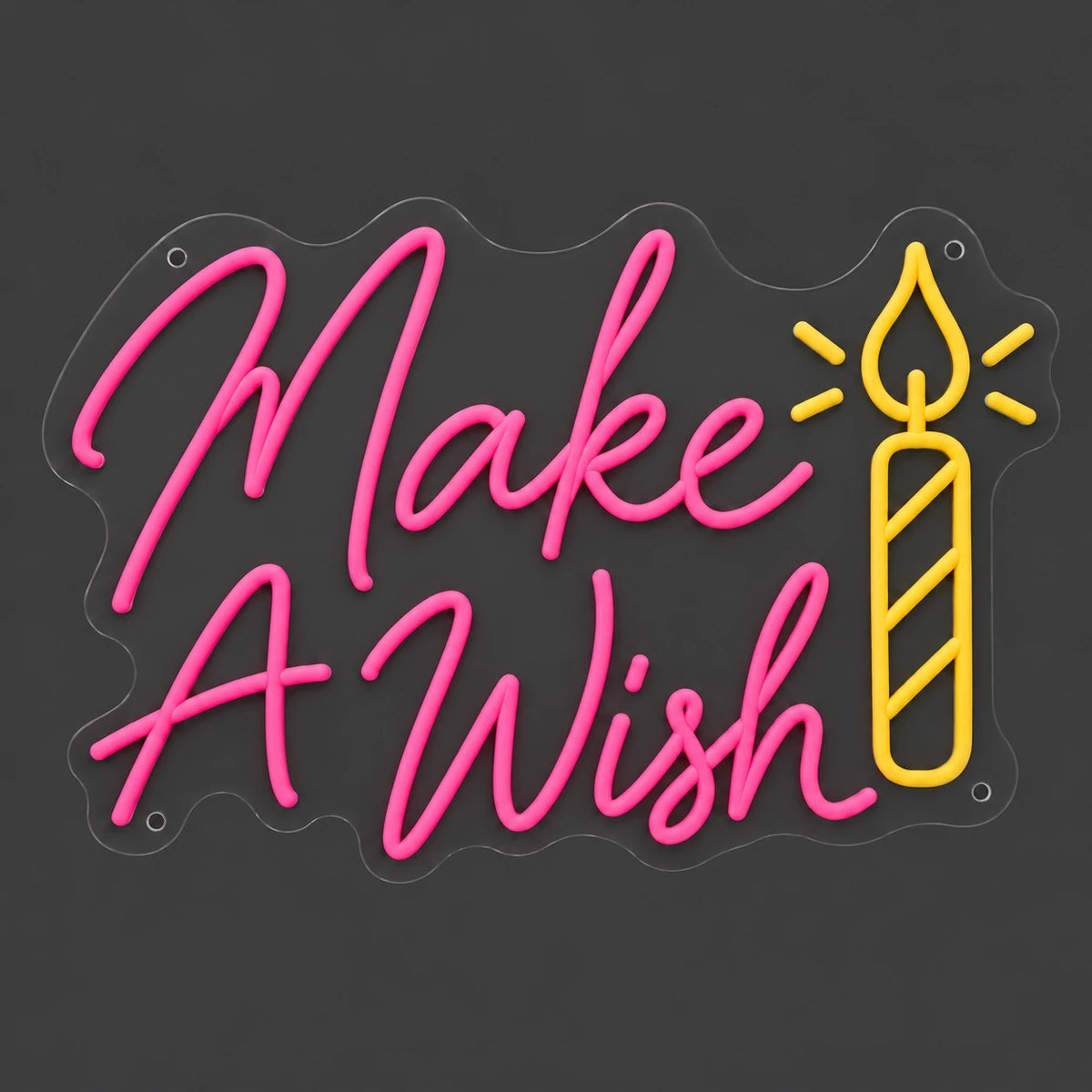 Pink Make A Wish candle neon sign lit on a dark gray background