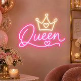 Queen neon sign with crown on a wall