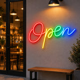 Rainbow open script LED neon sign on a salon feature wall