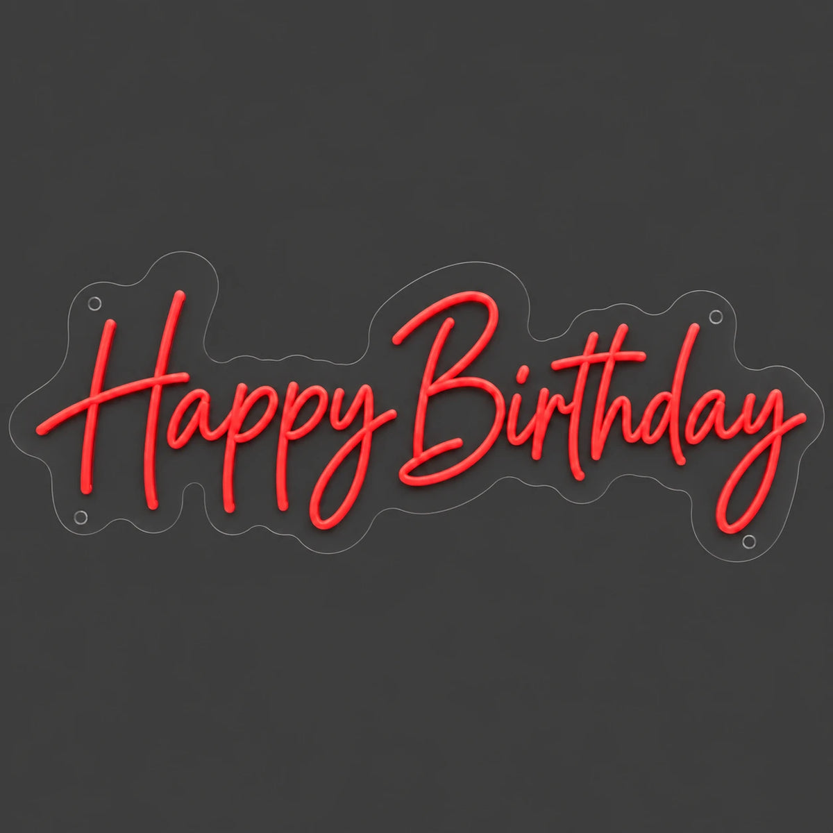 Red Happy Birthday neon sign lit on a dark gray background