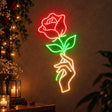Hand holding rose neon sign as romantic wedding décor