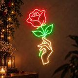 Hand holding rose neon sign as romantic wedding décor