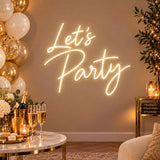 Warm white Let’s Party neon sign with gold balloon décor
