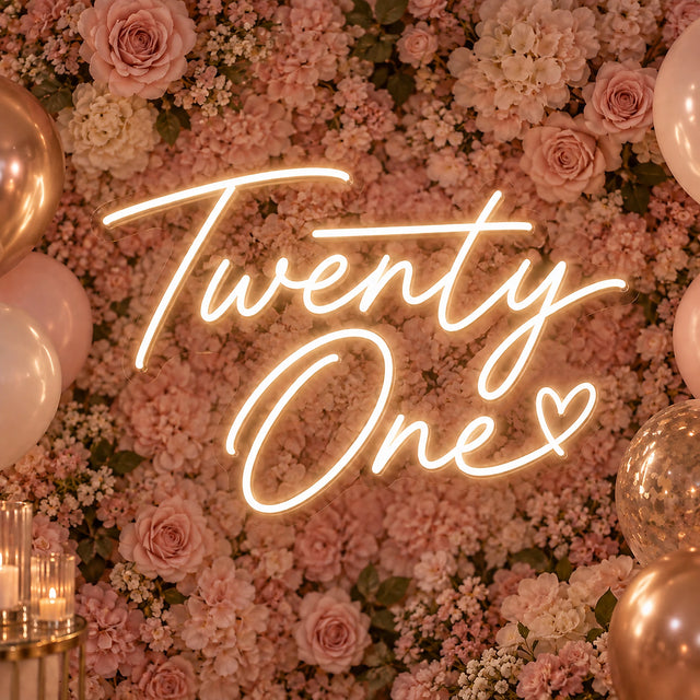Warm white Twenty One neon sign on a flower wall
