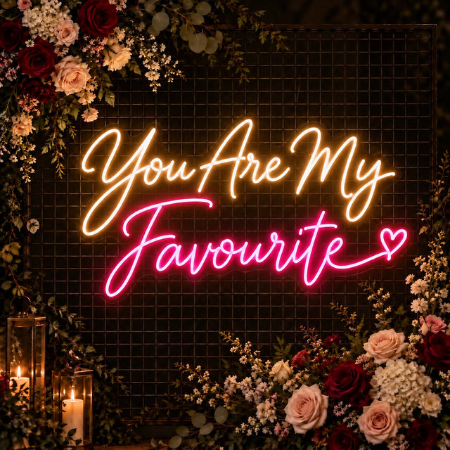 You Are My Favourite neon sign on a floral wedding backdrop